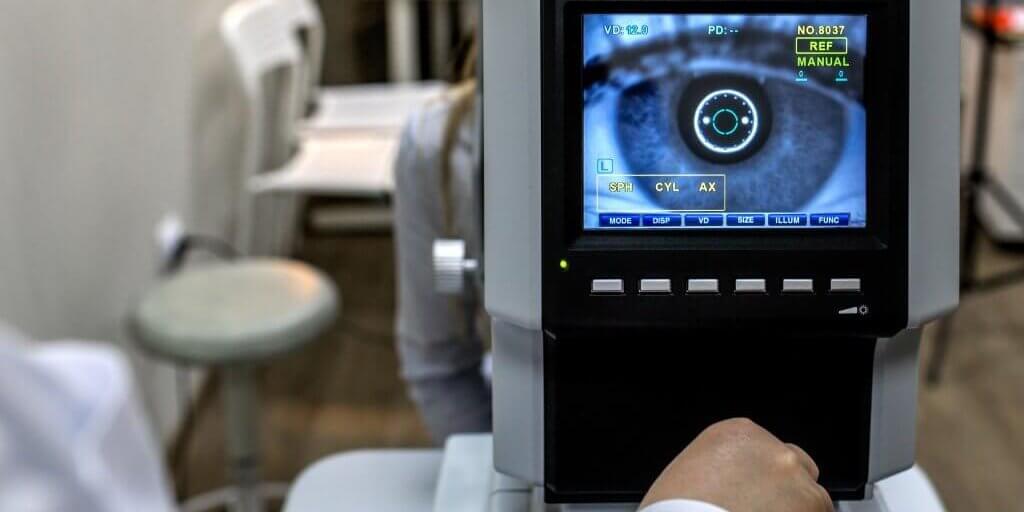 The Optical Instruments for examines the sight optometrist examining female patient in ophthalmology clinic