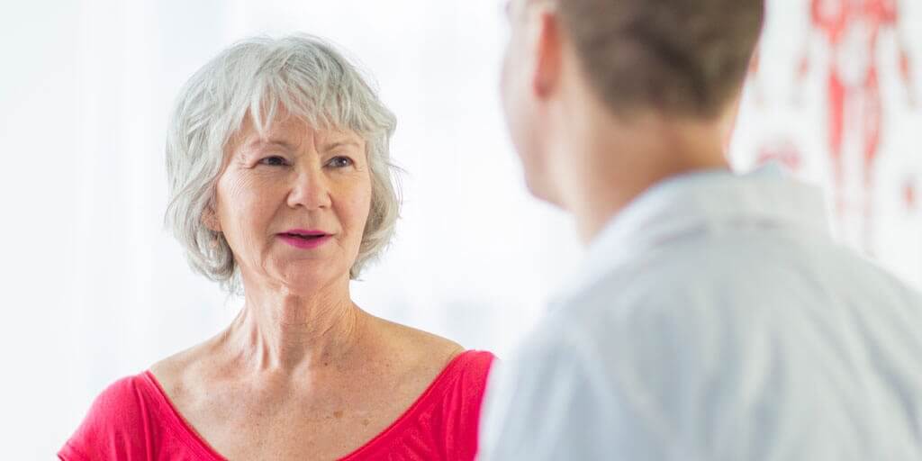 Senior woman talking with her doctor